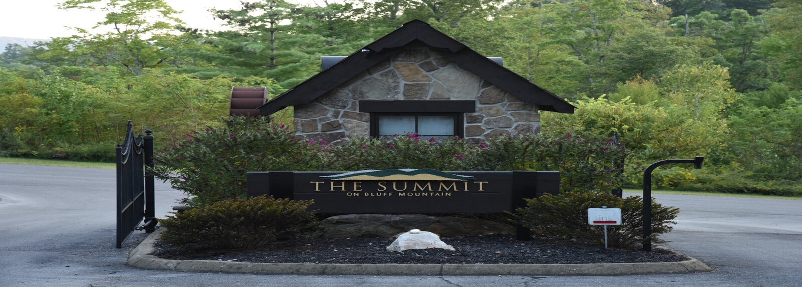 Stone gatehouse at the entrance to The Summit on Bluff Mountain