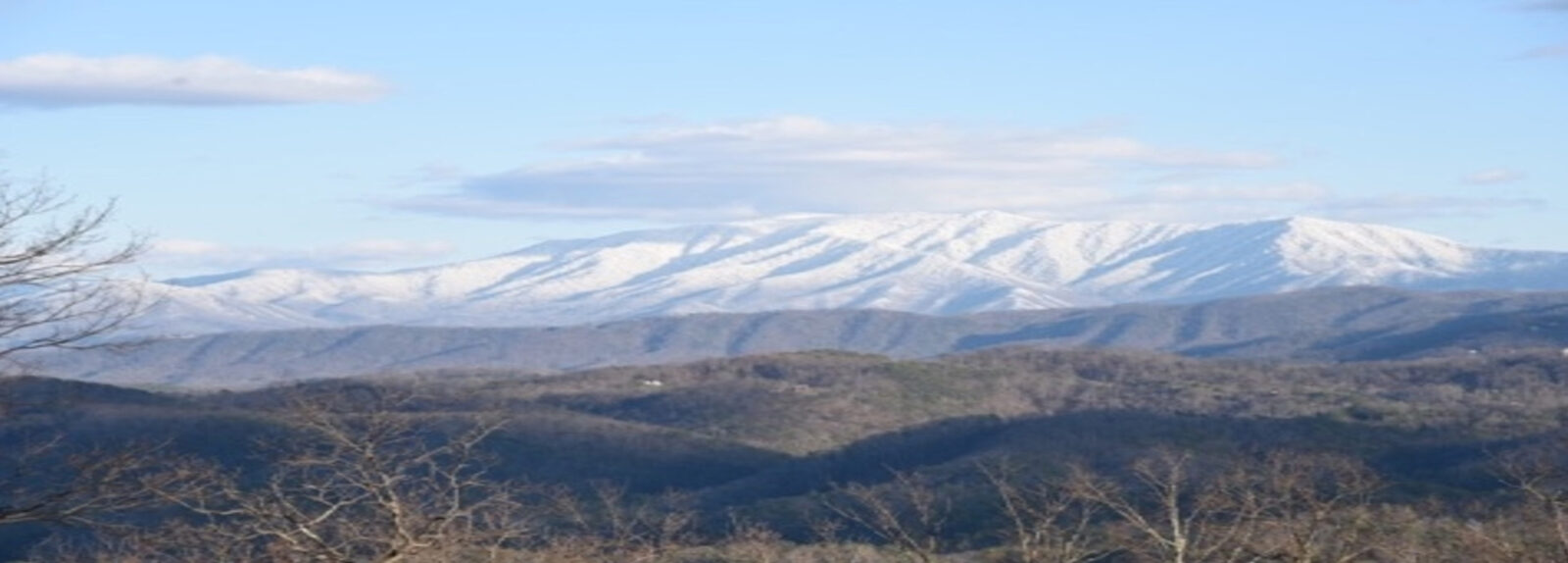 Snow-capped Smoky Mountain views from The Summit on Bluff Mountain