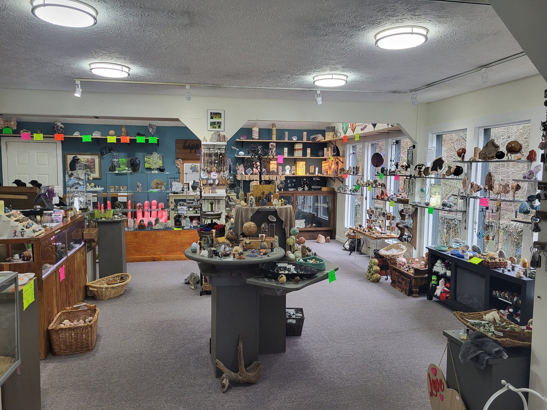 Interior of Agnes' Appalachian Gems rock shop with shelves of minerals, fossils and gifts