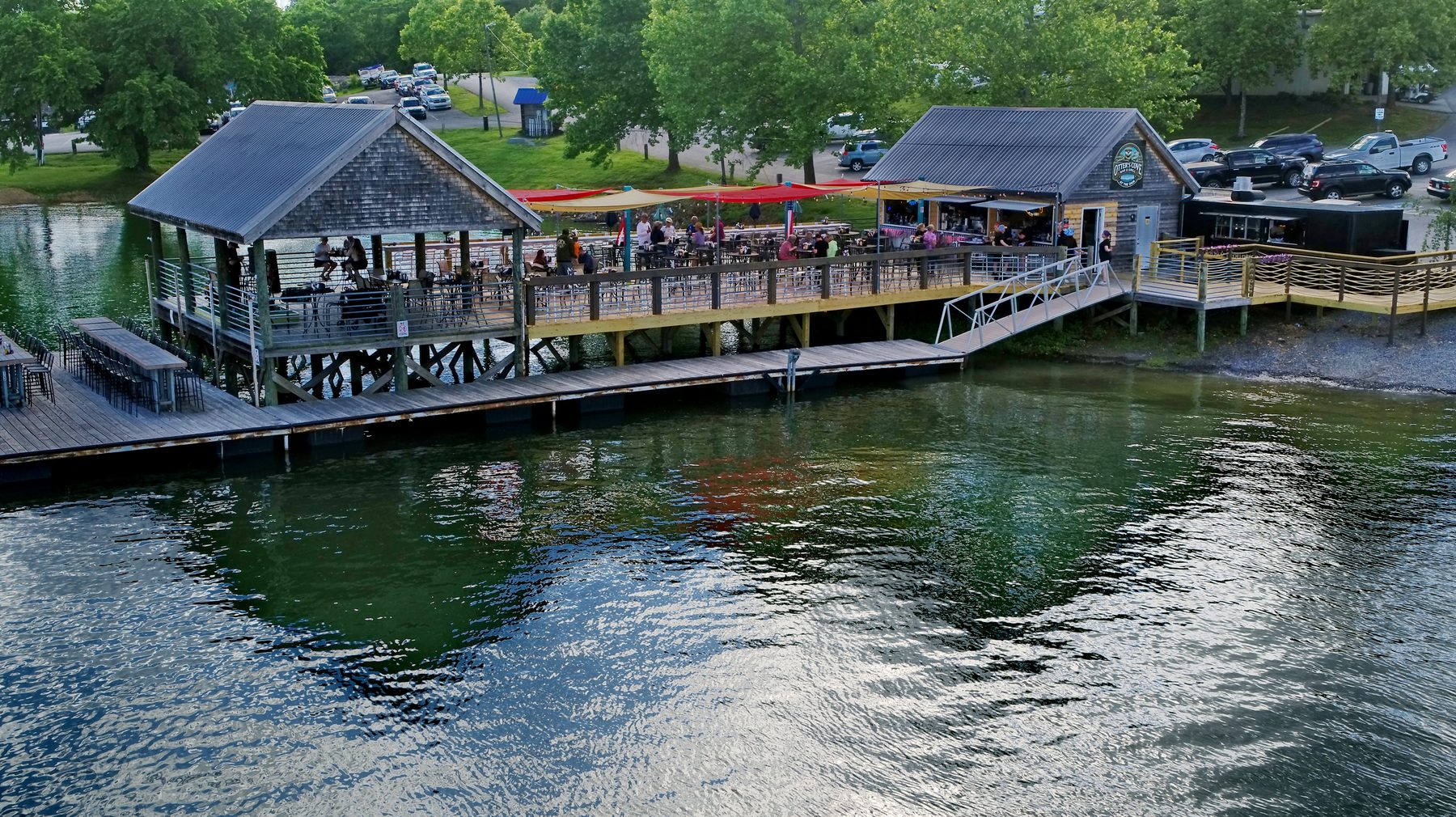 Aerial view of the lakeside pavilions and boardwalk docks at Lakeside RV Resort & Marina on Douglas Lake
