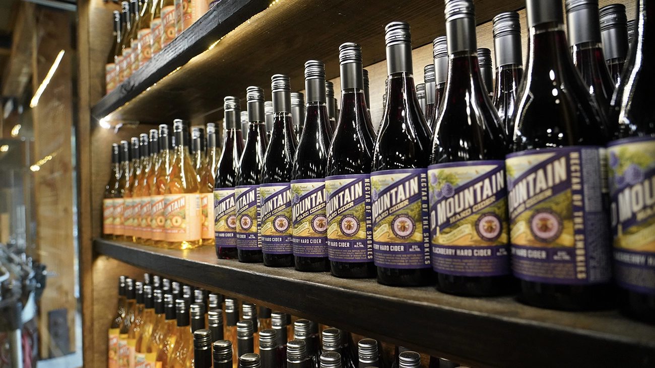 Shelves of Old Mountain Wine Company bottles in the Gatlinburg tasting room