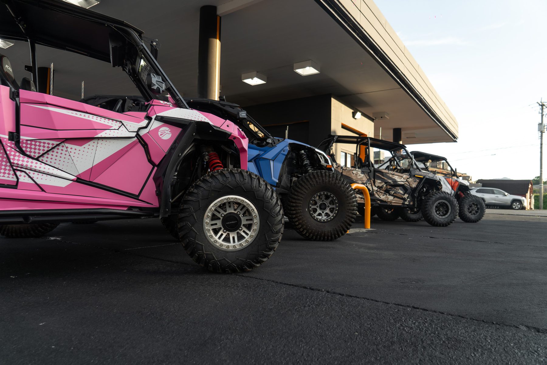 Row of OutRyde rental UTVs parked under a covered lot in Sevierville